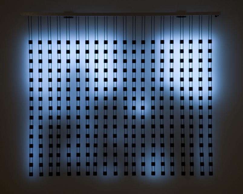 Jim Campbell, *Home Movies 300–3*, 2006. LED lights, custom electronics, and wire on metal wall brackets, 51 x 60 x 2 inches.