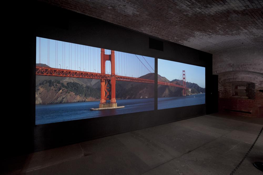 a two screen projected image of the Golden Gate Bridge