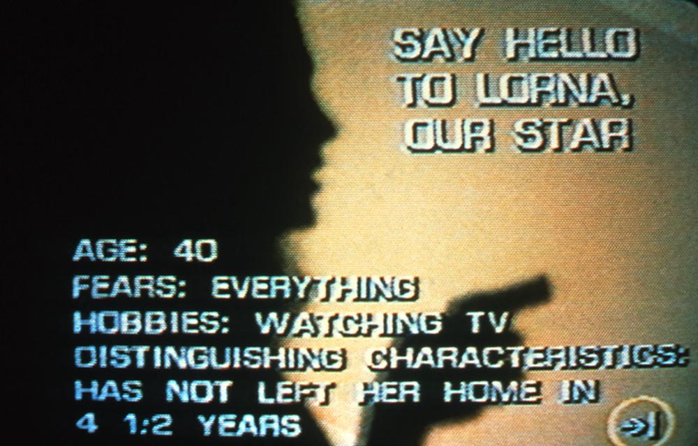 Video still from Lynn Hershman Leeson, *Lorna*, 1983–84. Interactive DVD installation, 78 1/2 x 128 x 52 inches.