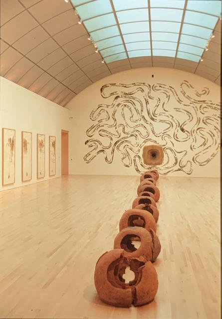 Installation view of Andy Goldsworthy’s *Clay Holes* (1994), *Snowball Drawings* (1994–95), and bracken and fern wall drawing (1995) in the exhibition *Breath of Earth*, San José Museum of Art, February 4–April 23, 1995.