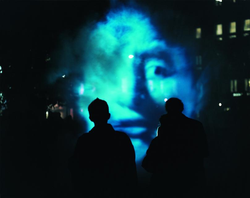 Installation view of Tony Oursler, *The Influence Machine*, 2000. Video, multiple projections, sound, and smoke.