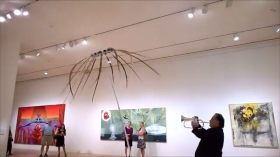 Jazz musician John Worley improvising to Alan Rath’s kinetic sculpture *Absolutely* (2012),