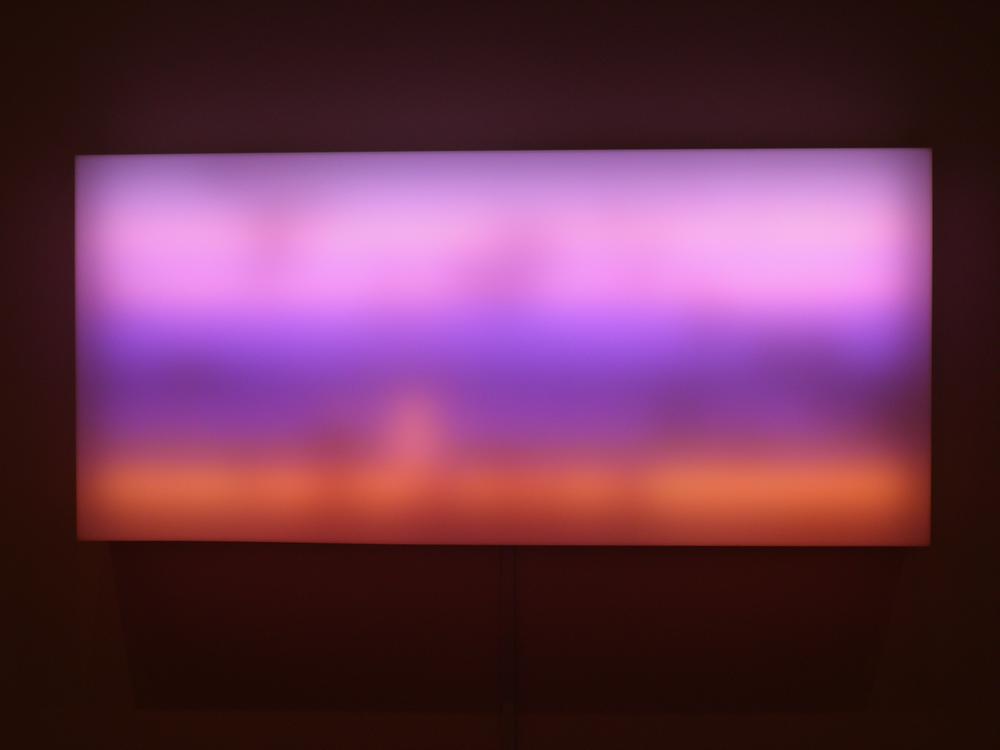 lightbox with lanscape orientation and color gradation with light purple on top dark purple in the middle and orange at the bottom