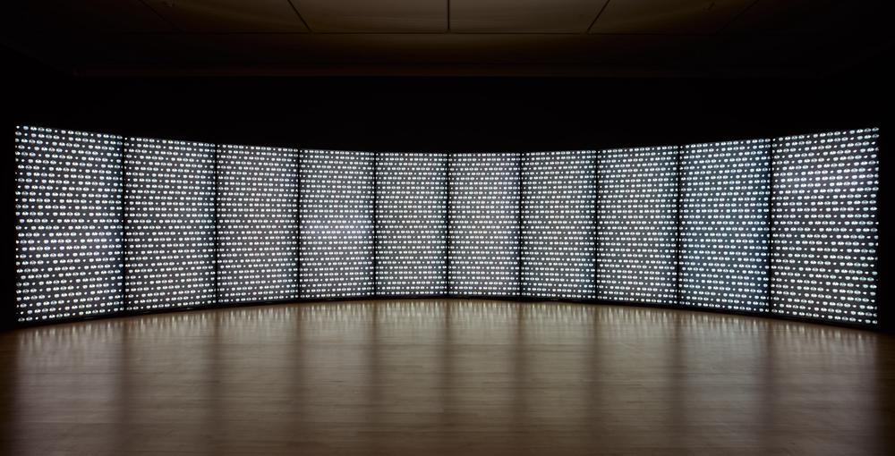 10-paneled lightbox installation in darkened room to show a pattern illuminated on the screen and creating ambient lighting